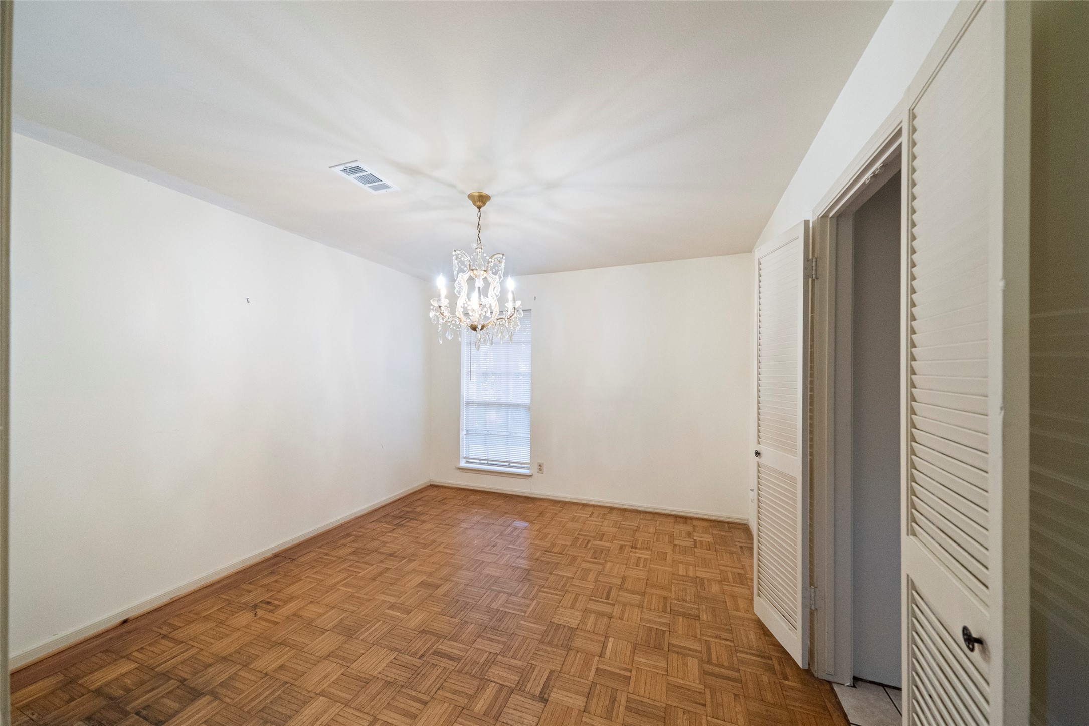 1115 Pear Tree Lane Houston, TX 77073 - Photo 8 of 30 a view of an empty room with a chandelier