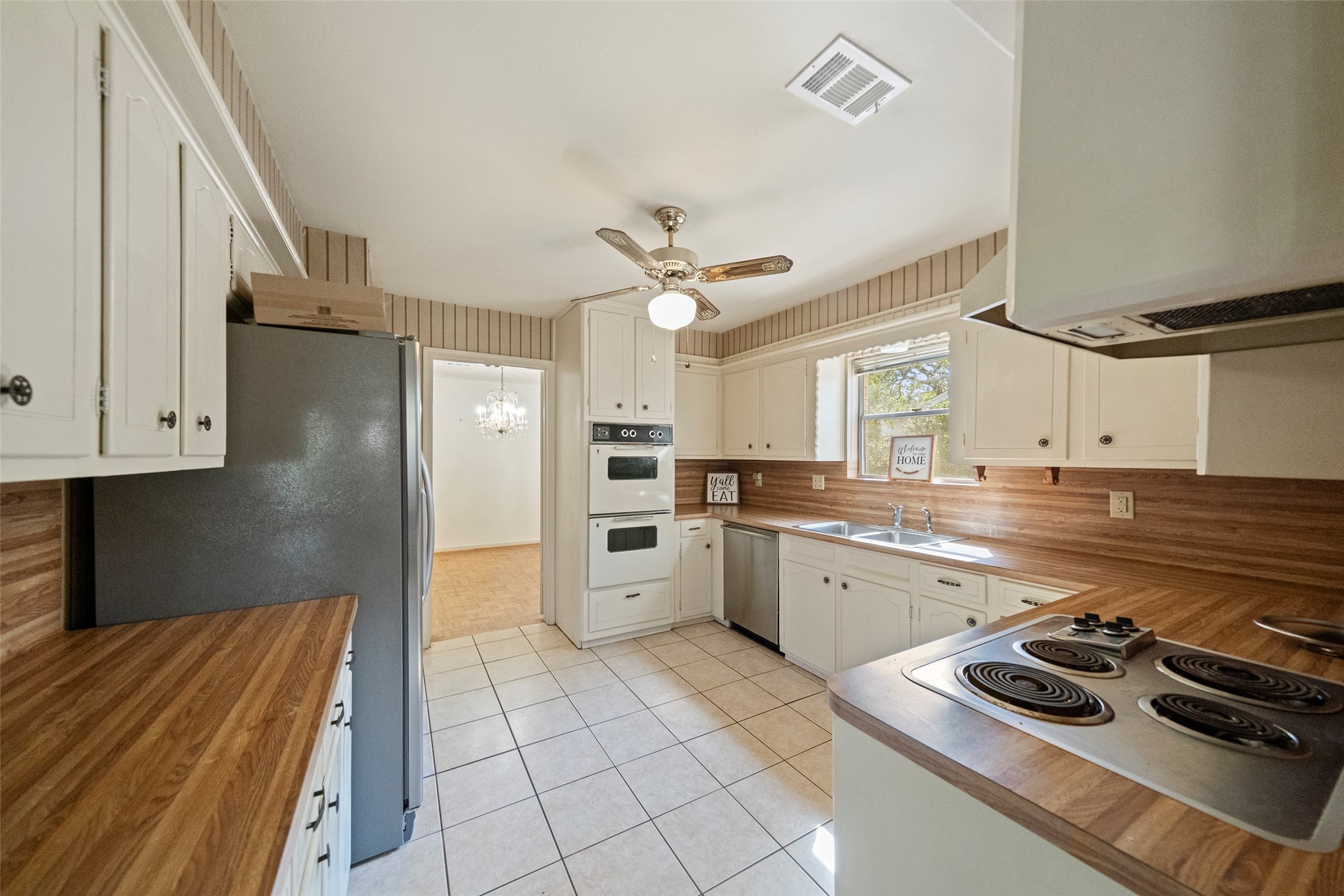 1115 Pear Tree Lane Houston, TX 77073 - Photo 9 of 30 a kitchen with a sink appliances and cabinets