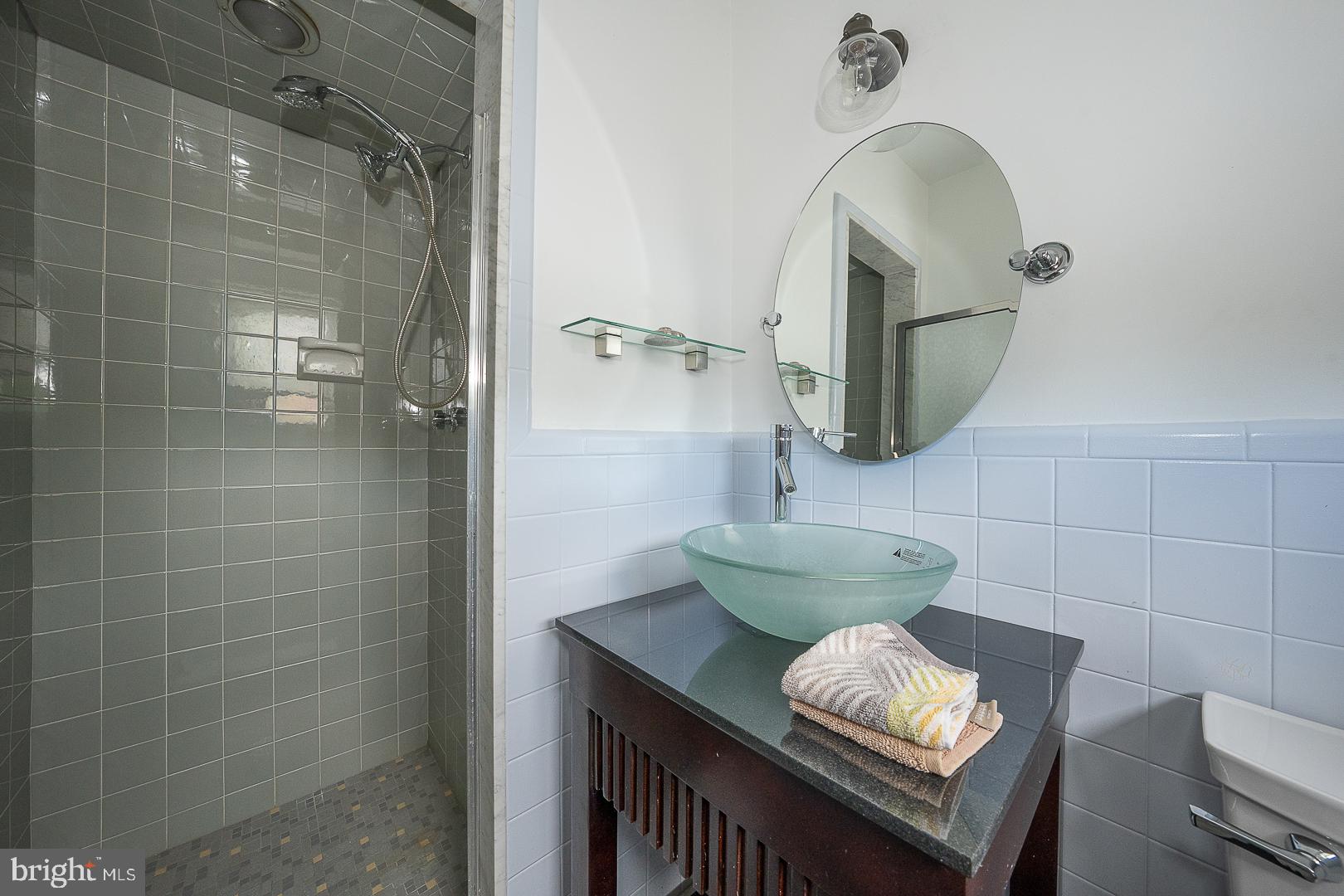 20 Fairview Road Swarthmore, PA 19081 - Photo 25 of 57 a bathroom with a sink and a mirror