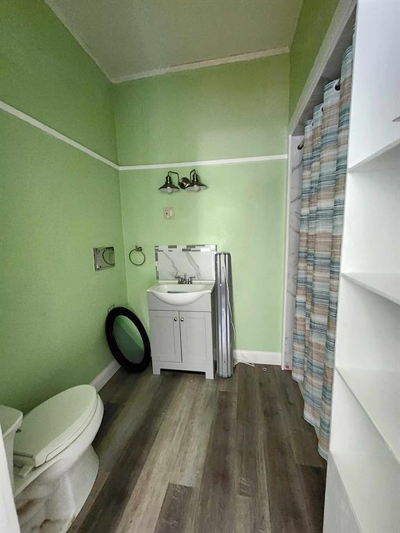 205 South 2nd Street Logansport, LA 71049 - Photo 15 of 36 a bathroom with a sink toilet and shower