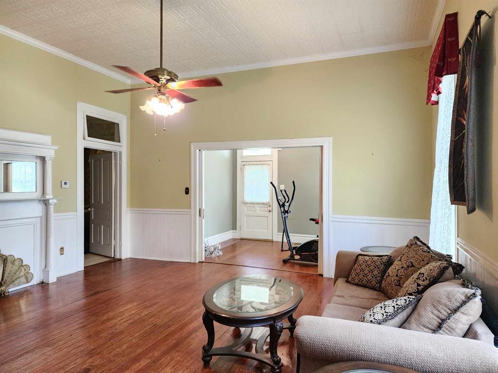 205 South 2nd Street Logansport, LA 71049 - Photo 16 of 36 a living room with furniture a window and a chandelier