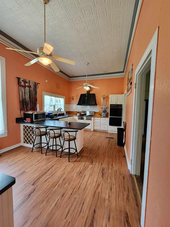 205 South 2nd Street Logansport, LA 71049 - Photo 21 of 36 a view of a dining room with furniture window and wooden floor