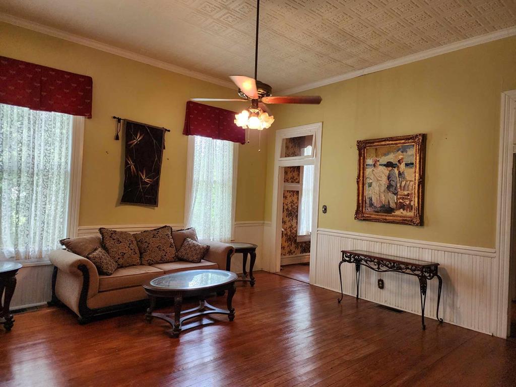 205 South 2nd Street Logansport, LA 71049 - Photo 29 of 36 a living room with furniture and wooden floor