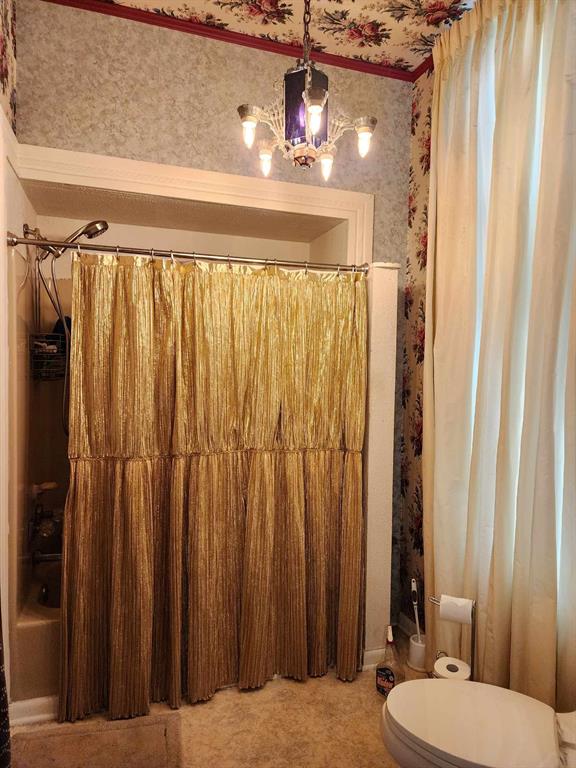205 South 2nd Street Logansport, LA 71049 - Photo 30 of 36 a bathroom with a sink a toilet and shower curtain
