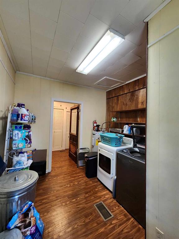 205 South 2nd Street Logansport, LA 71049 - Photo 36 of 36 a kitchen that has a lot of cabinets a sink and a stove in it