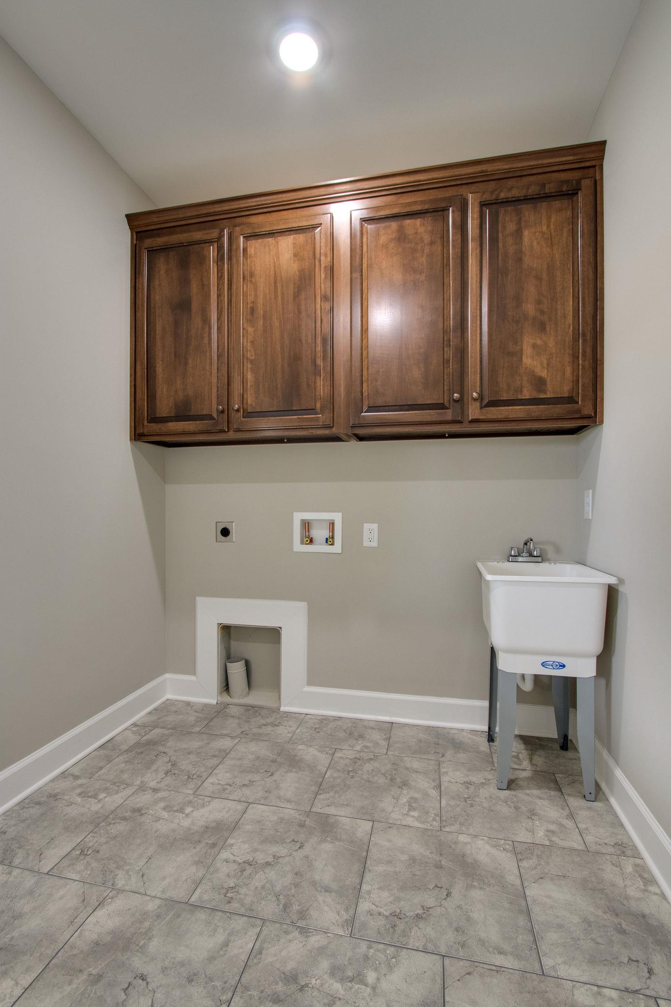 1634 Goshen Road Lebanon, TN 37087 - Photo 14 of 23 Utility room has it own set of beautiful cabinet and laundry tub with an outside entrance to the large 12X30 back porch.
