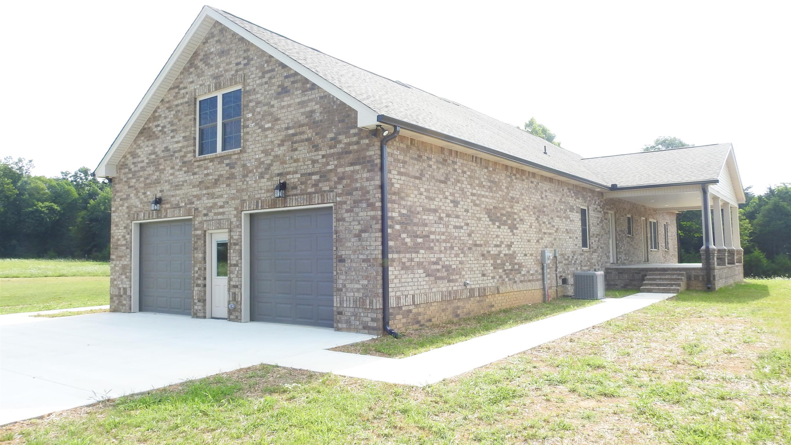 1634 Goshen Road Lebanon, TN 37087 - Photo 4 of 23 Sidewalks to back porch and front porch-Walk thru door into 31X28 oversized garage