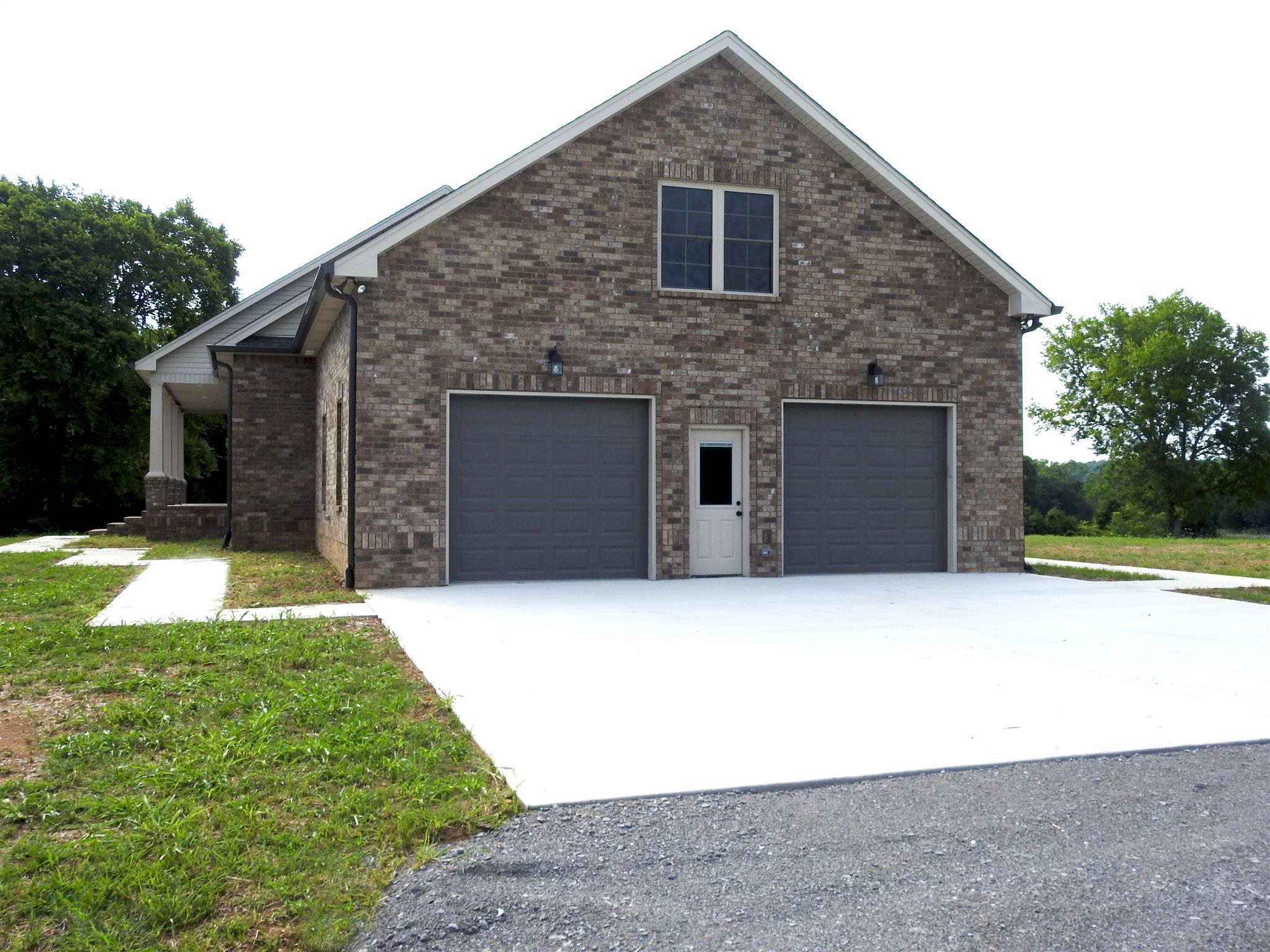 1634 Goshen Road Lebanon, TN 37087 - Photo 5 of 23 Wonderful oversized garages with room for work bench or cars/motor cycles, etc. w/separate entrance to bonus room/Office area