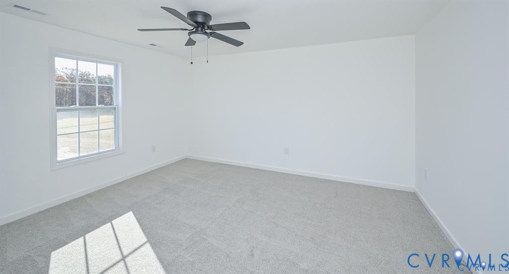 26471 Slash Pine Circle Ruther Glen, VA 22546 - Photo 26 of 36 an empty room with windows and closet