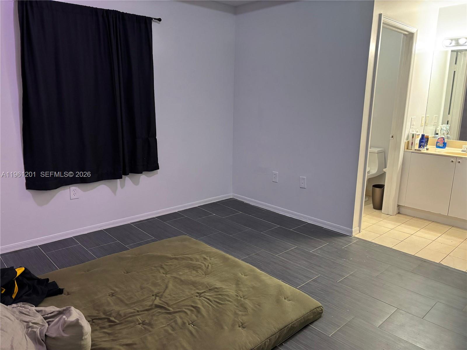 2907 Southeast 15th Terrace Homestead, FL 33035 - Photo 17 of 30 a view of a closet area with wooden floor