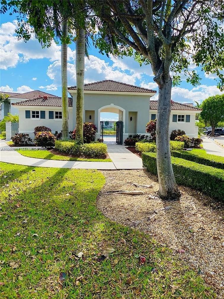 2907 Southeast 15th Terrace Homestead, FL 33035 - Photo 25 of 30 a view of a house with a yard and tree s