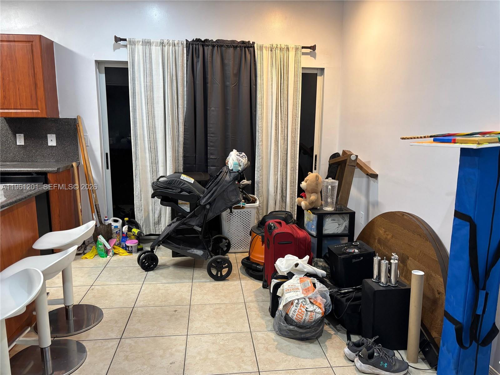 2907 Southeast 15th Terrace Homestead, FL 33035 - Photo 7 of 30 a room with furniture and gym equipment