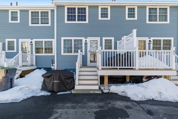 a front view of a house with a bench