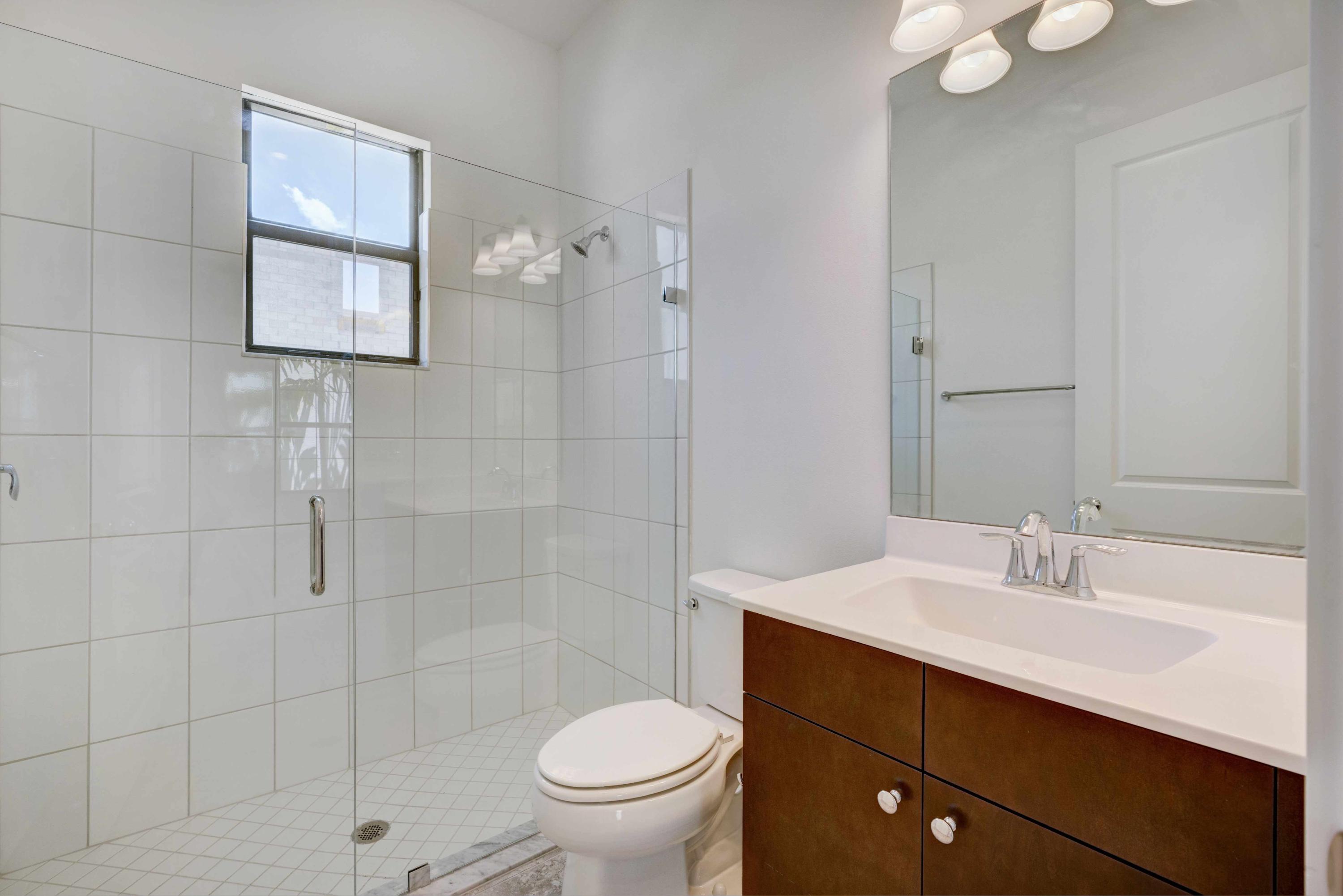 13221 Alton Road Palm Beach Gardens, FL 33418 - Photo 14 of 54 1st floor full bath