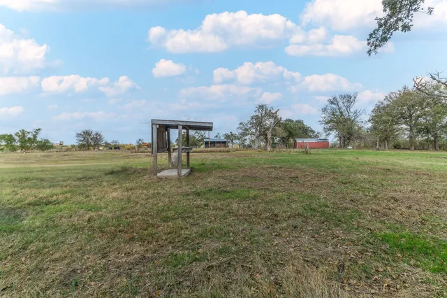 a view of outdoor space with deck and yard