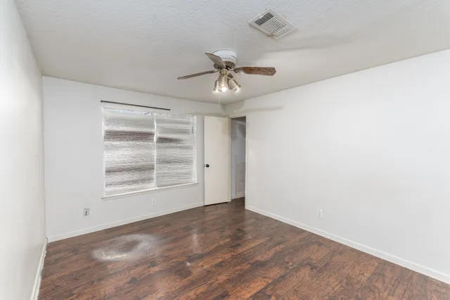 an empty room with a empty space and a window