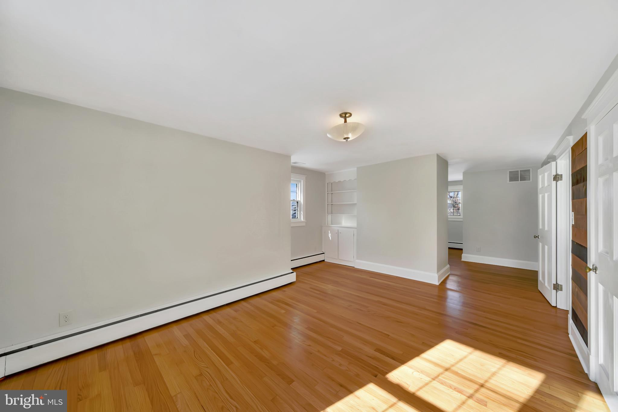 2675 Jolly Acres Road White Hall, MD 21161 - Photo 20 of 50 an empty room with wooden floor and windows