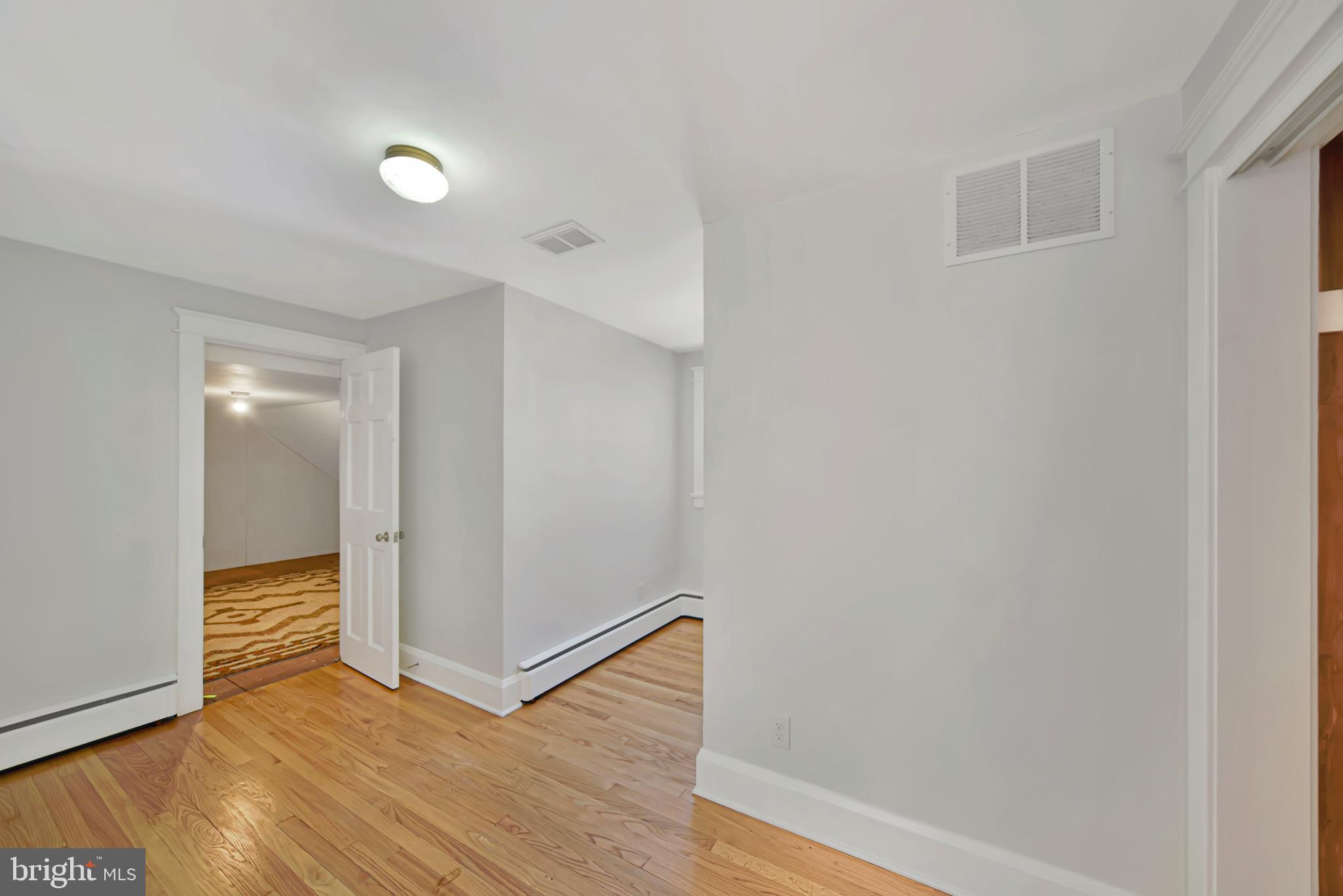 2675 Jolly Acres Road White Hall, MD 21161 - Photo 22 of 50 a view of an empty room with wooden floor and closet