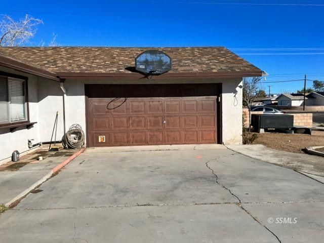 305 South Silver Ridge Street Ridgecrest, CA 93555 - Photo 32 of 32 a front view of a house with a garage