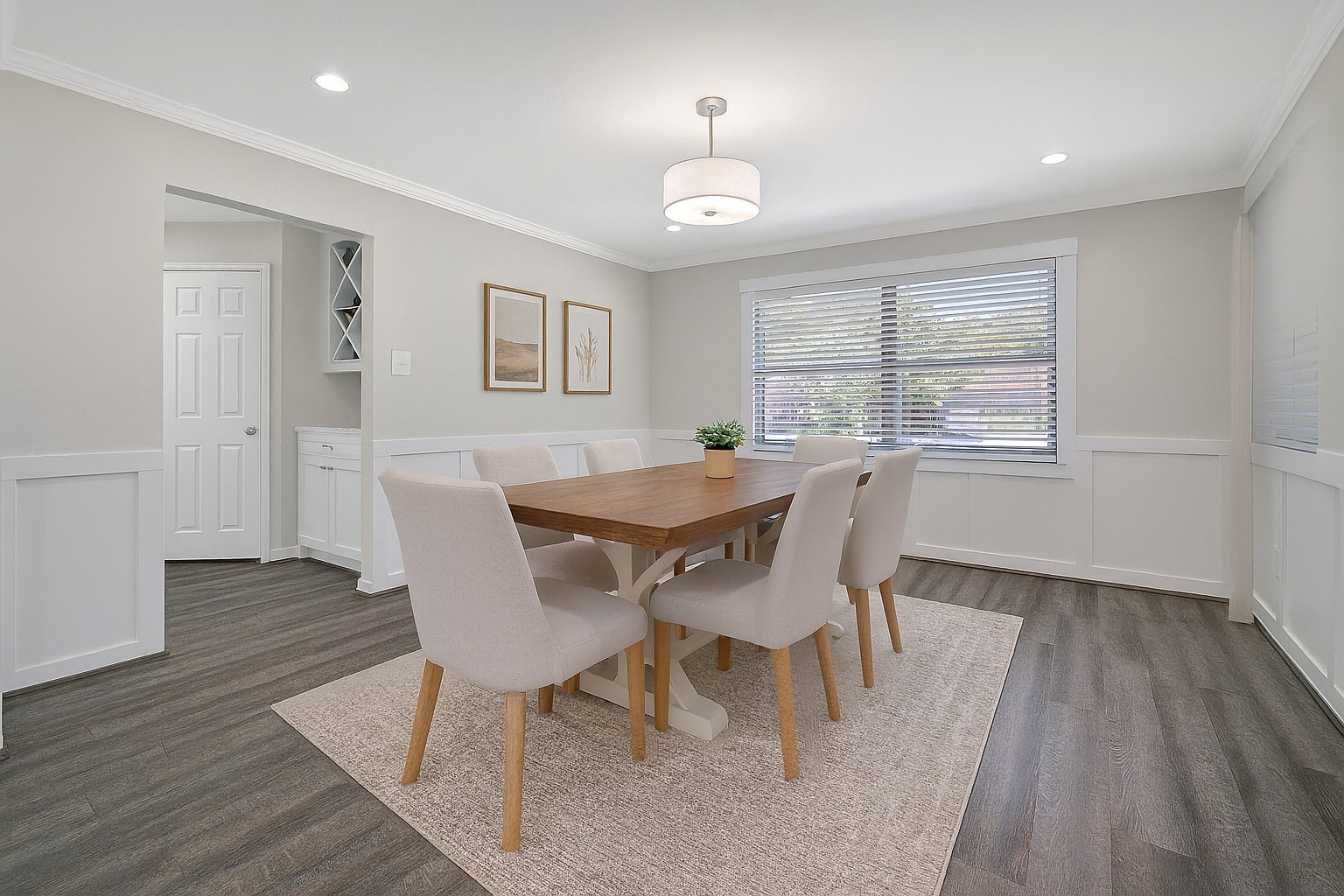 4402 Fallbrook Drive Houston, TX 77018 - Photo 11 of 29 Formal dining room with abundant natural light and updated flooring. Virtually Staged
