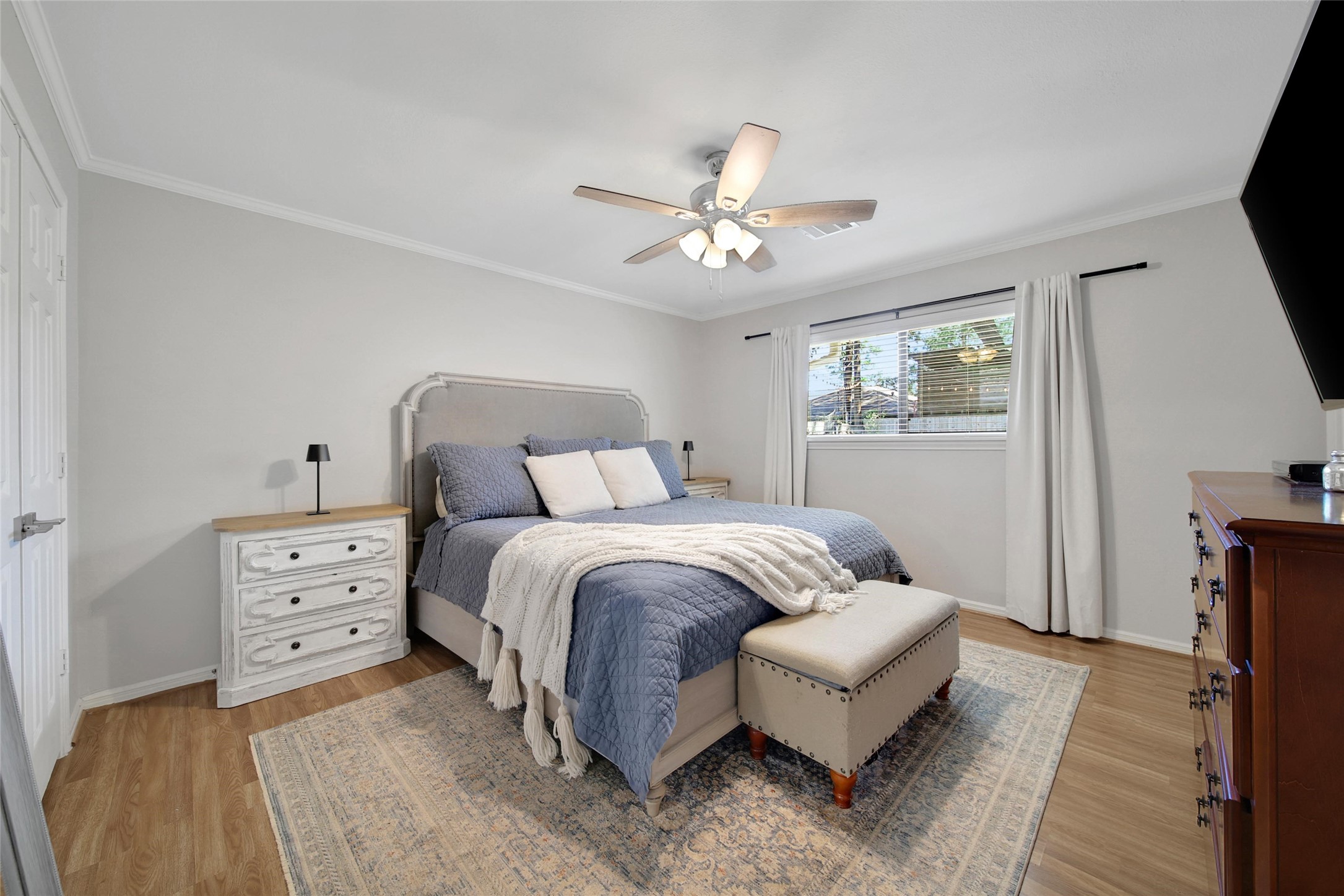 4402 Fallbrook Drive Houston, TX 77018 - Photo 19 of 29 Primary bedroom with great natural light, updated flooring, and plenty of space for large furnishings.