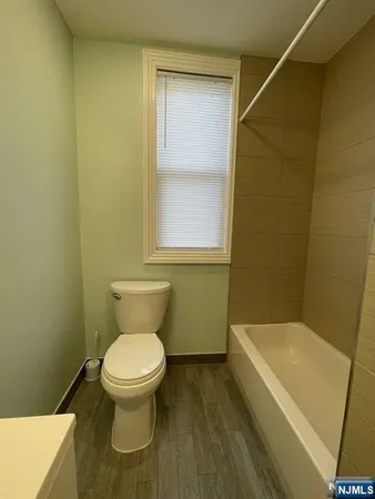 a bathroom with a toilet and a sink