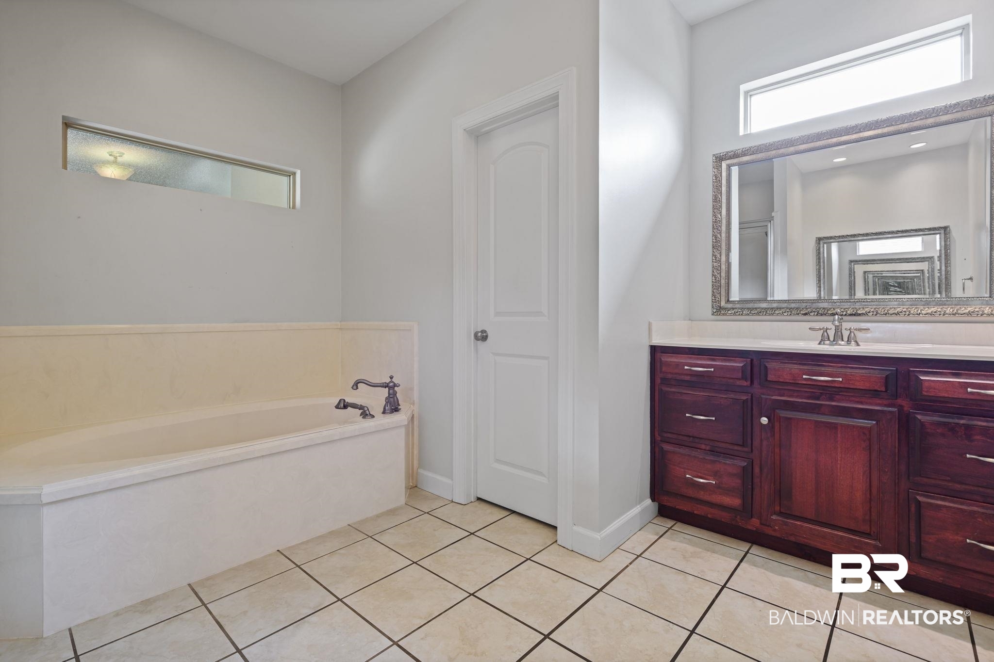 9730 Harmony Ridge Circle West Semmes, AL 36575 - Photo 16 of 38 Bathroom with vanity, a bath, tile patterned floors, and baseboards