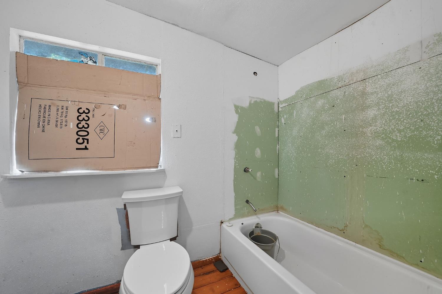 16300 Rossbridge Road Jackson, CA 95642 - Photo 31 of 40 a white toilet sitting next to a bathroom sink and tub