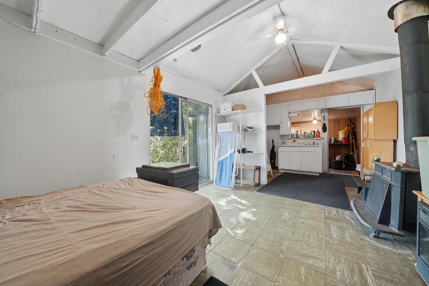 16300 Rossbridge Road Jackson, CA 95642 - Photo 37 of 40 a bedroom with a bed and a large mirror on the dresser