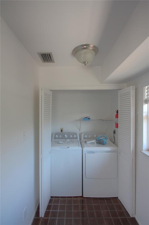307 South Osprey Avenue, Unit 307 Sarasota, FL 34236 - Photo 3 of 8 a utility room with dryer and washer