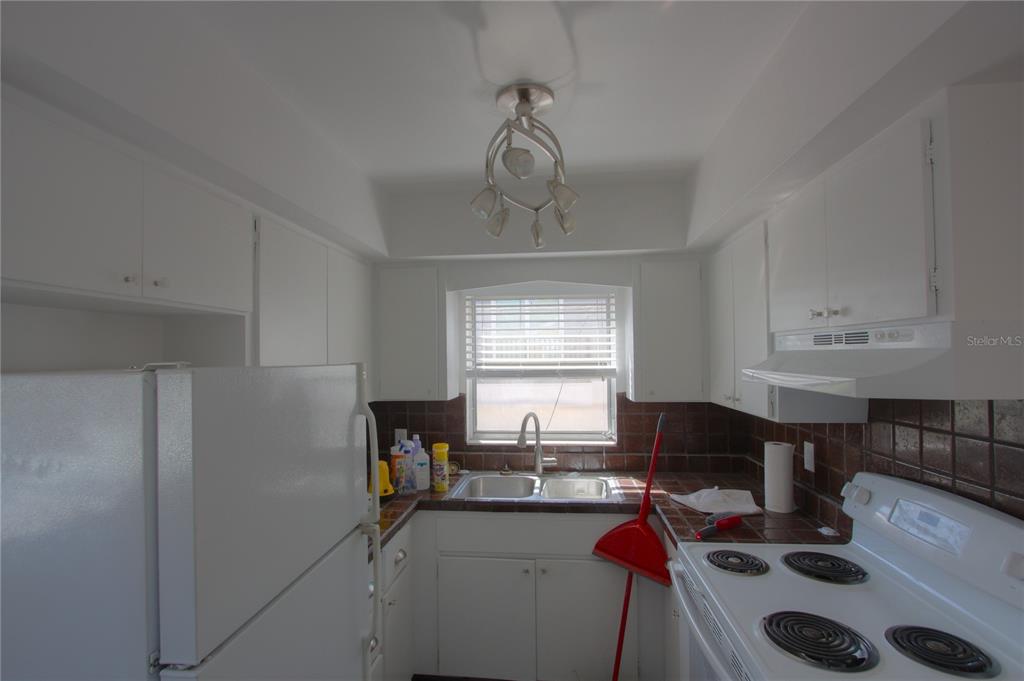 307 South Osprey Avenue, Unit 307 Sarasota, FL 34236 - Photo 4 of 8 a view of a workspace with furniture and window