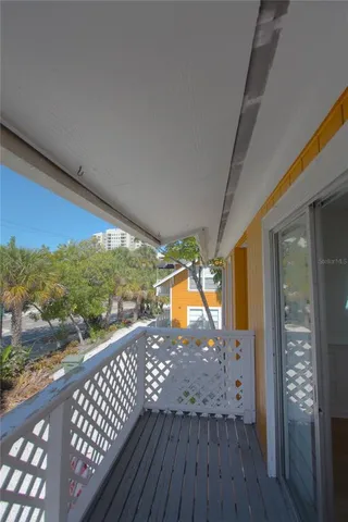 a view of a balcony with wooden floor