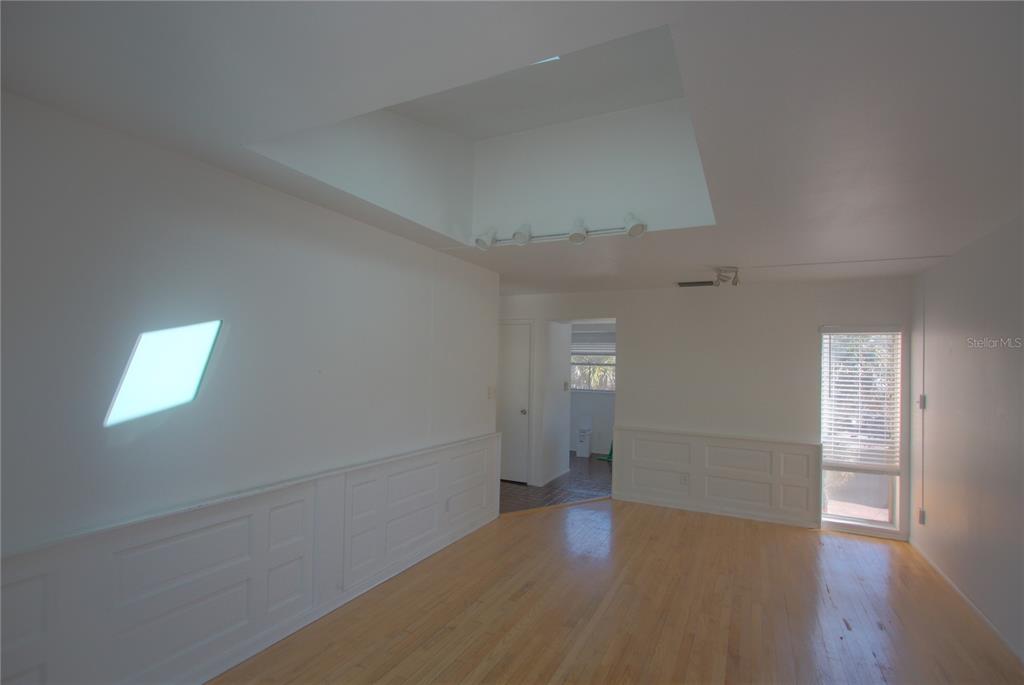 307 South Osprey Avenue, Unit 307 Sarasota, FL 34236 - Photo 6 of 8 wooden floor in an empty room