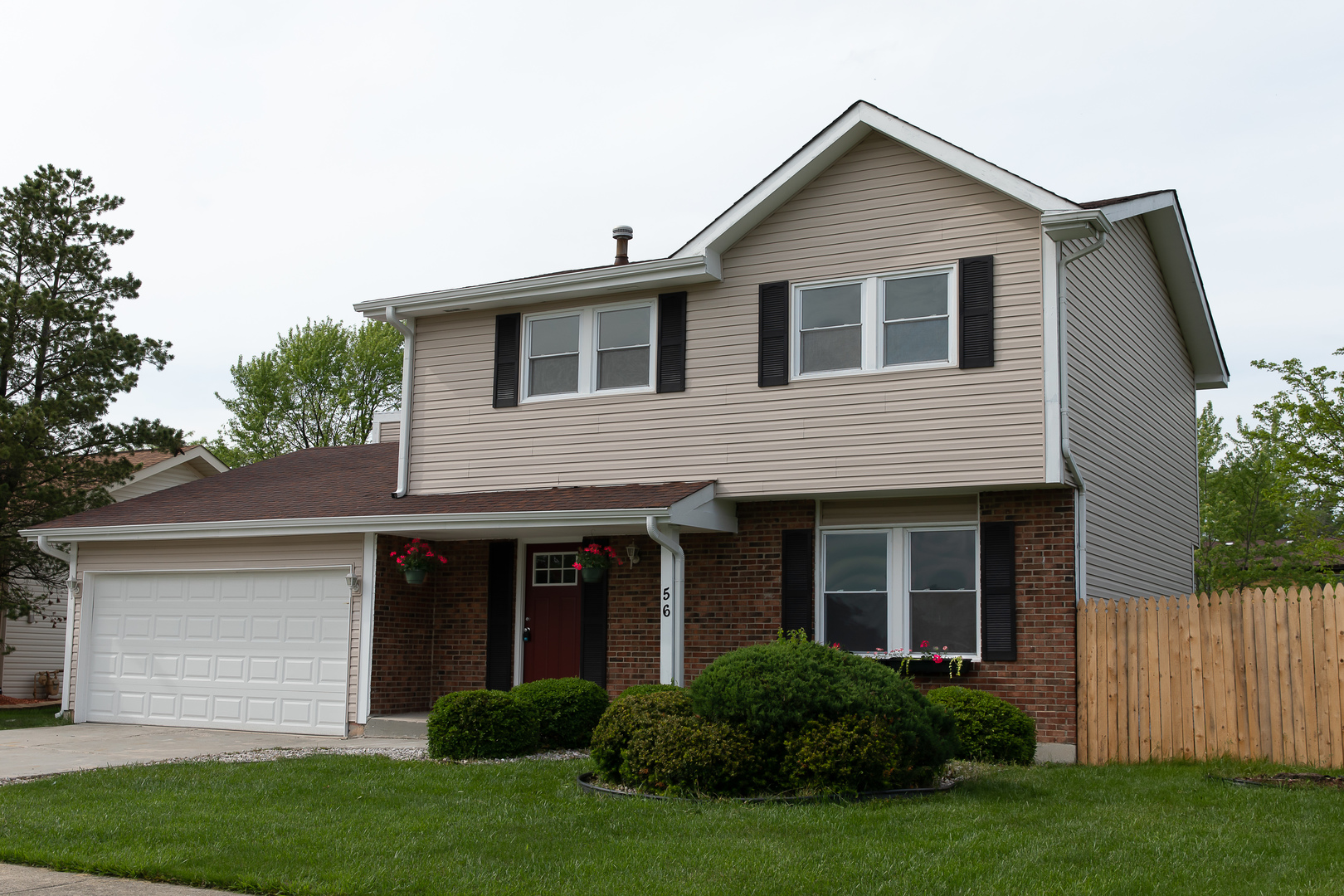 56 White Oaks Road Matteson, IL 60443 - Photo 1 of 20 a view of a house with a yard and plants