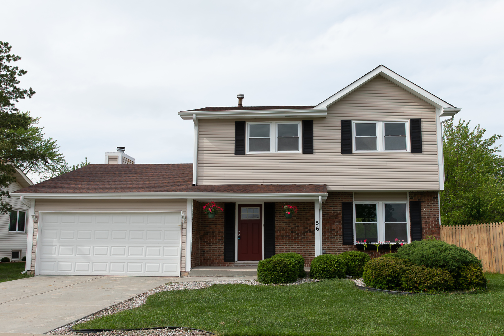 56 White Oaks Road Matteson, IL 60443 - Photo 2 of 20 a front view of a house with a yard and garage