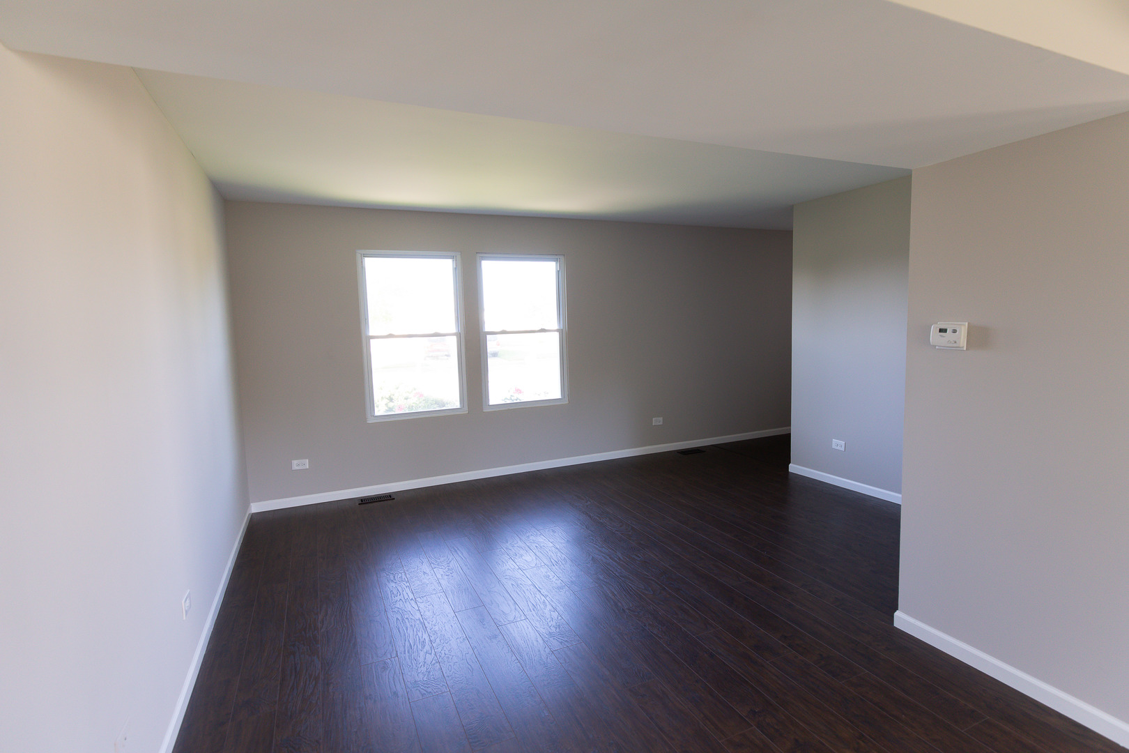 56 White Oaks Road Matteson, IL 60443 - Photo 13 of 20 an empty room with wooden floor and windows