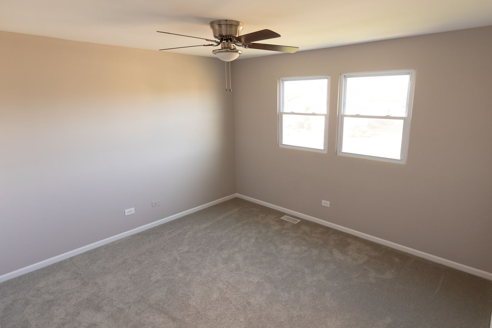 56 White Oaks Road Matteson, IL 60443 - Photo 15 of 20 an empty room with a window and a fan
