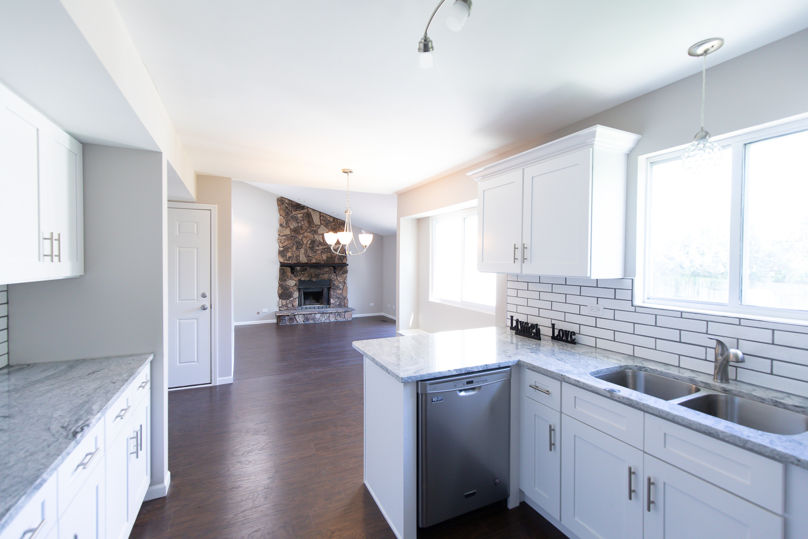 56 White Oaks Road Matteson, IL 60443 - Photo 5 of 20 a kitchen with sink cabinets and window