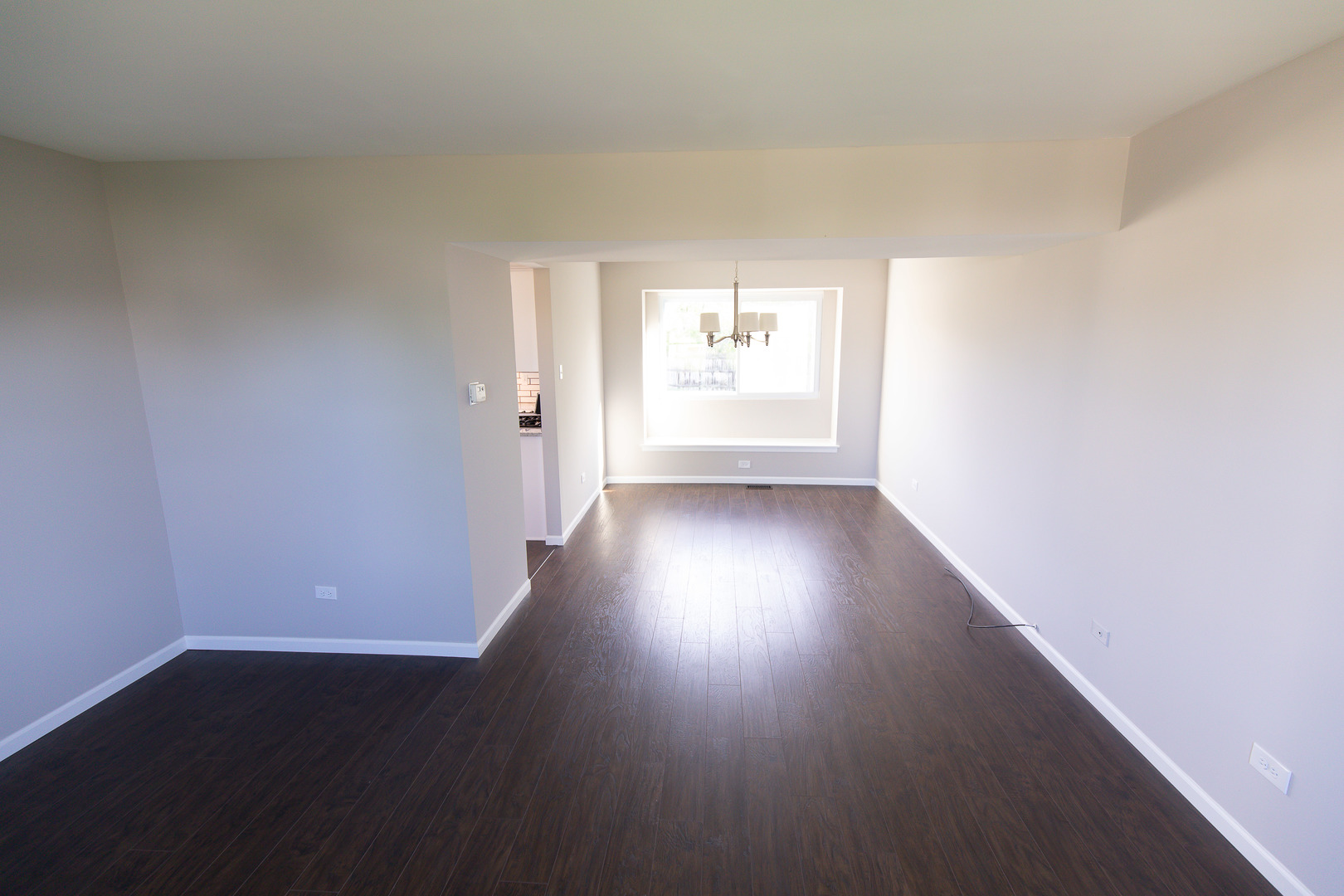 56 White Oaks Road Matteson, IL 60443 - Photo 9 of 20 an empty room with wooden floor and windows