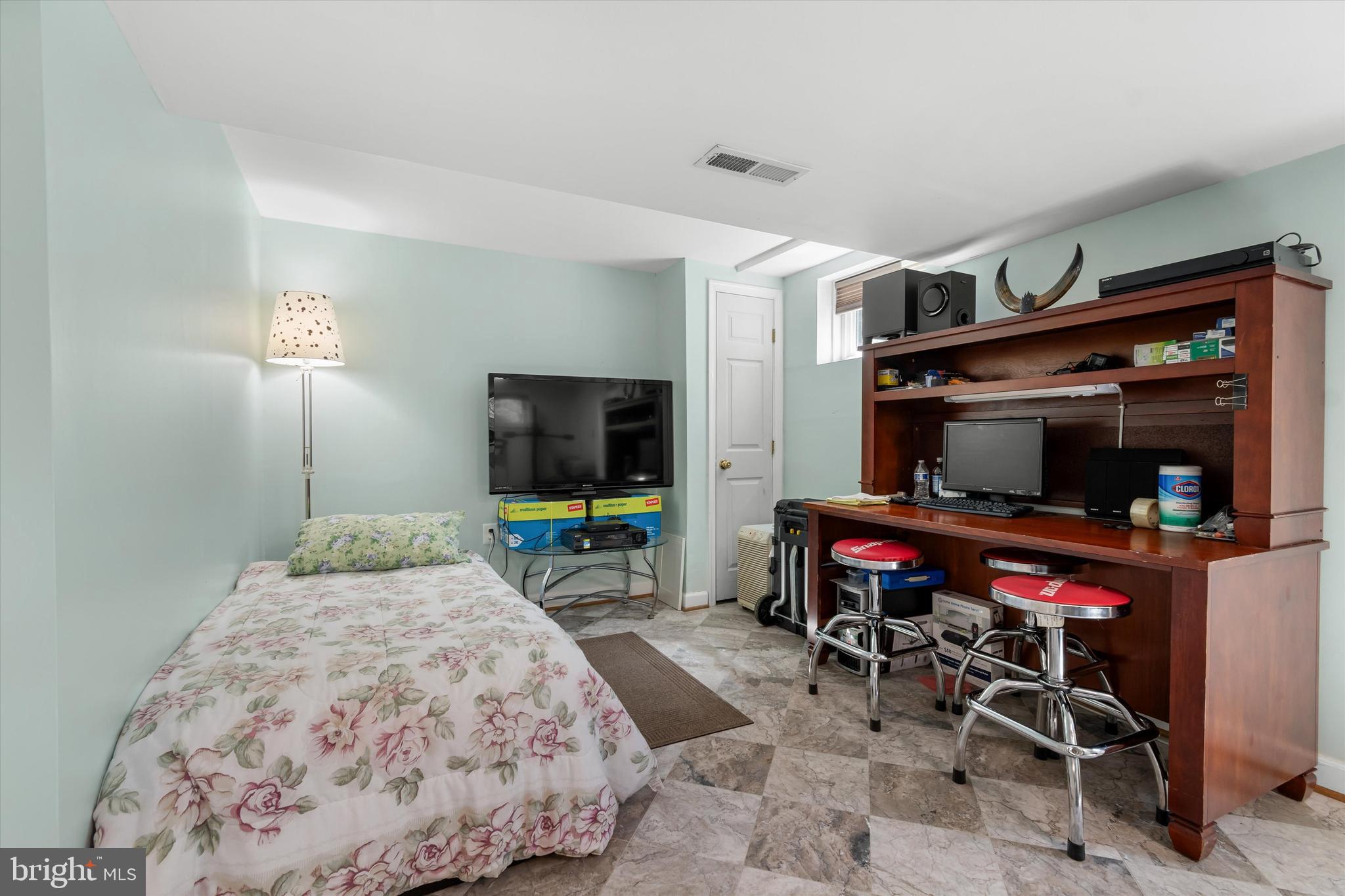 8304 Harland Drive Springfield, VA 22152 - Photo 32 of 39 a bedroom with furniture and a flat screen tv