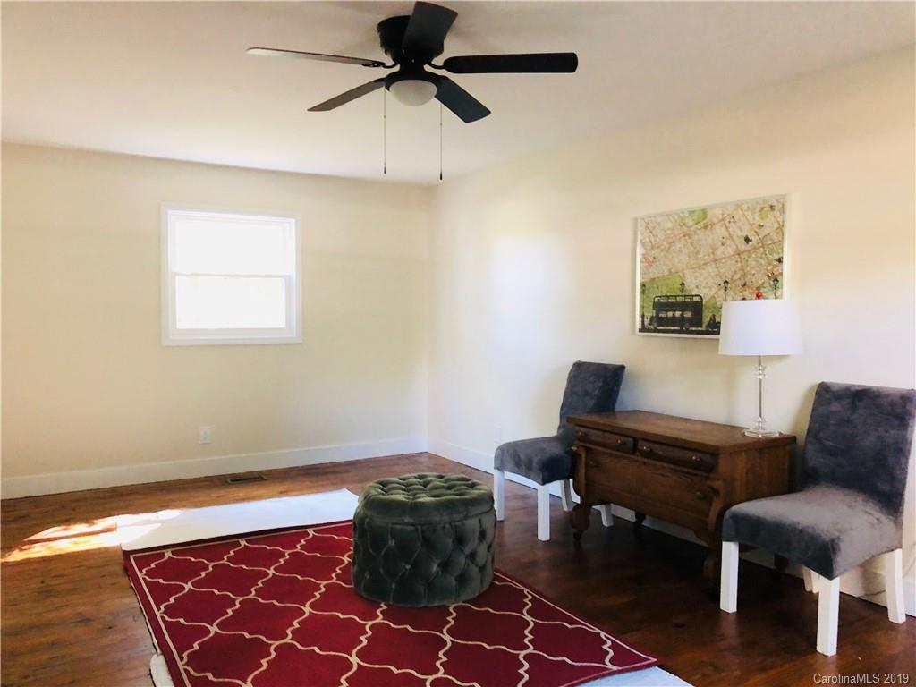 15016 Ranson Road Huntersville, NC 28078 - Photo 18 of 27 a living room with furniture and a rug