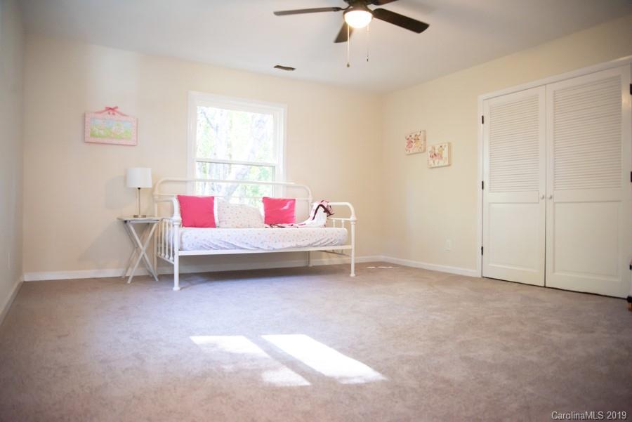 15016 Ranson Road Huntersville, NC 28078 - Photo 20 of 27 a living room with furniture and a ceiling fan