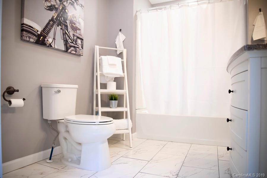 15016 Ranson Road Huntersville, NC 28078 - Photo 24 of 27 a bathroom with a sink a toilet and shower