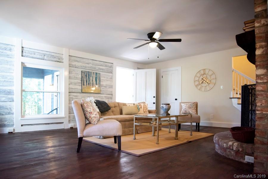 15016 Ranson Road Huntersville, NC 28078 - Photo 7 of 27 a living room with furniture a flat screen tv and a window
