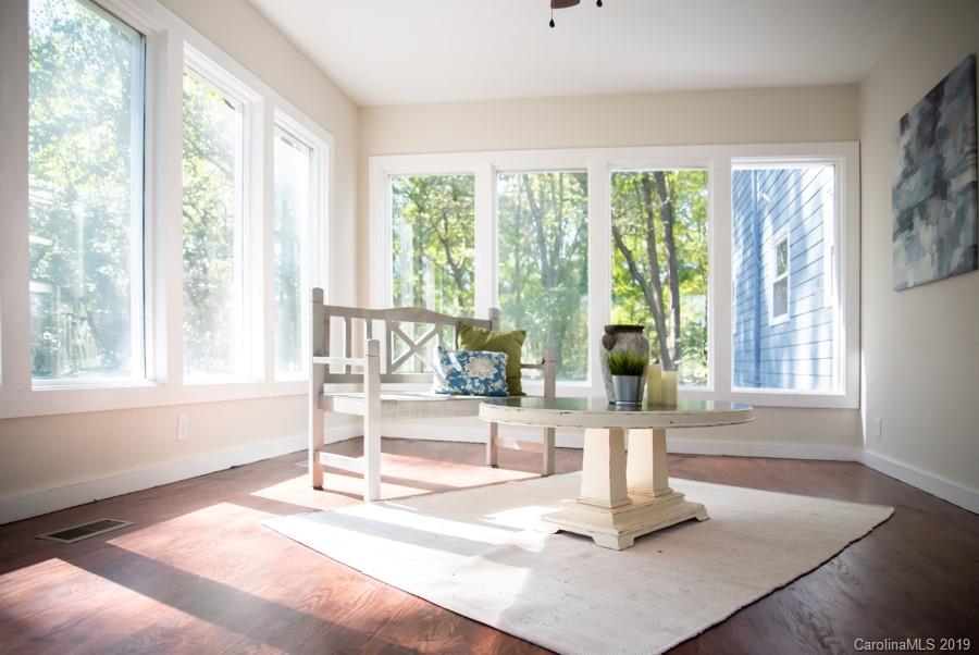 15016 Ranson Road Huntersville, NC 28078 - Photo 9 of 27 a living room with a floor to ceiling window and floor to ceiling windows