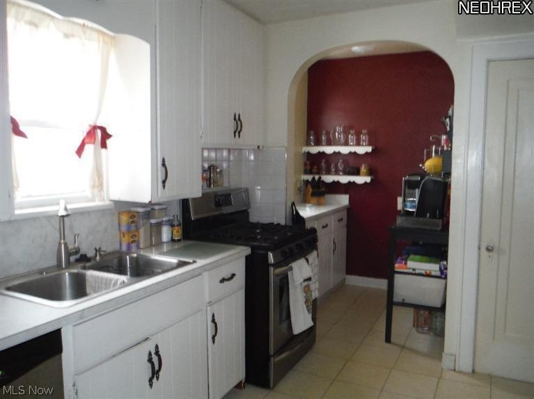 815 Ranney Street Akron, OH 44310 - Photo 6 of 21 The kitchen is as cute as can be with plenty of room for cooking up some fun! There is a cozy little breakfast nook thru the arched doorway with its own window and more cabinetry for storage