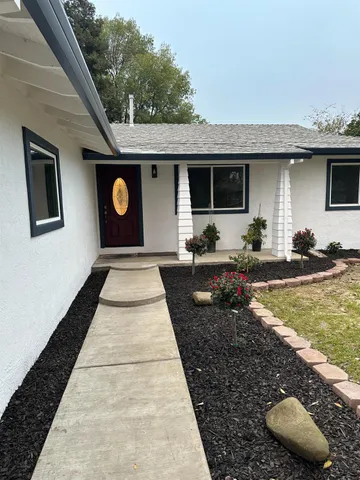 a front view of a house with yard