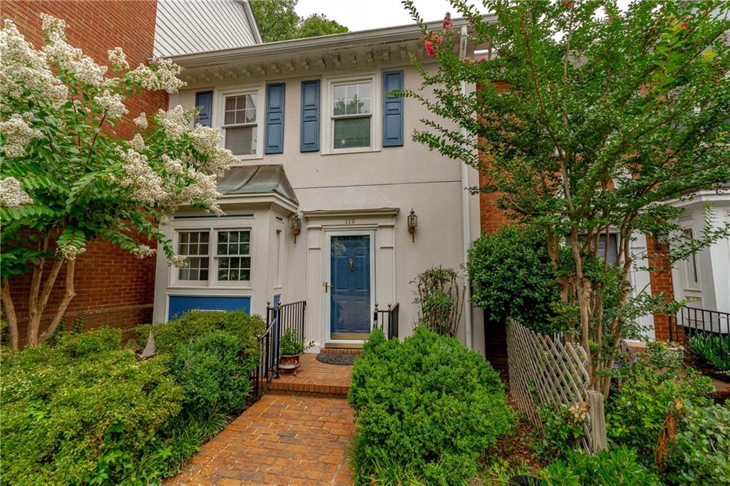 110 Brantley Road Sandy Springs, GA 30350 - Photo 1 of 1 a view of a house with potted plants and large trees