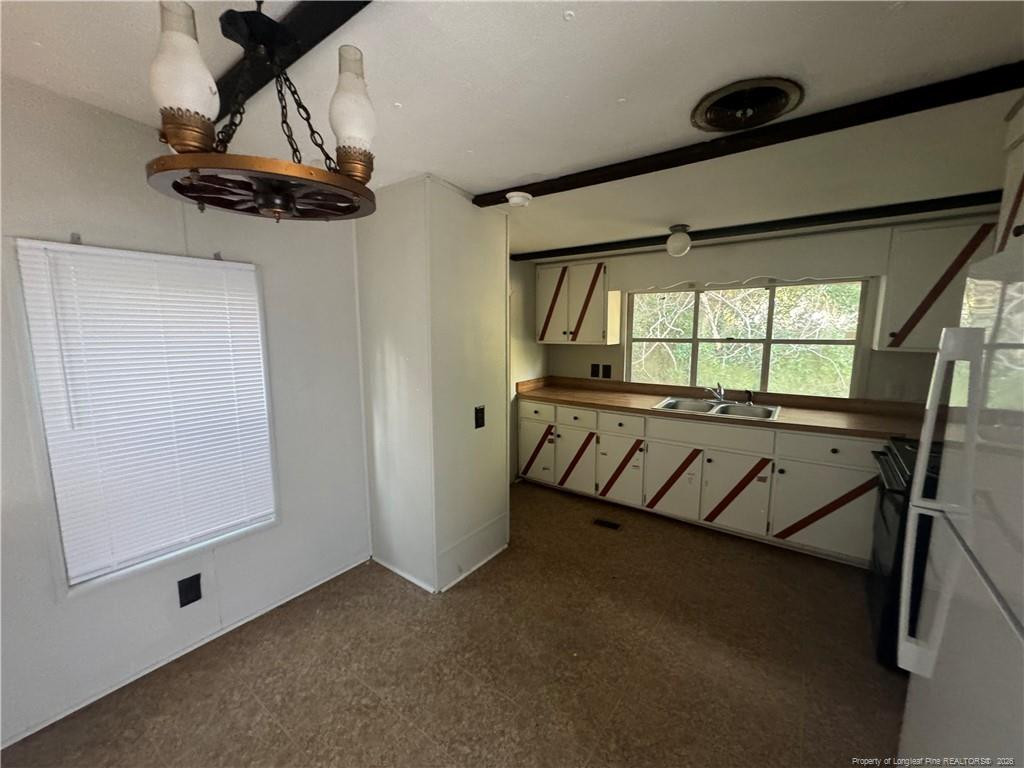 1738 Strickland Bridge Road Fayetteville, NC 28304 - Photo 3 of 9 a view of an empty room with a window