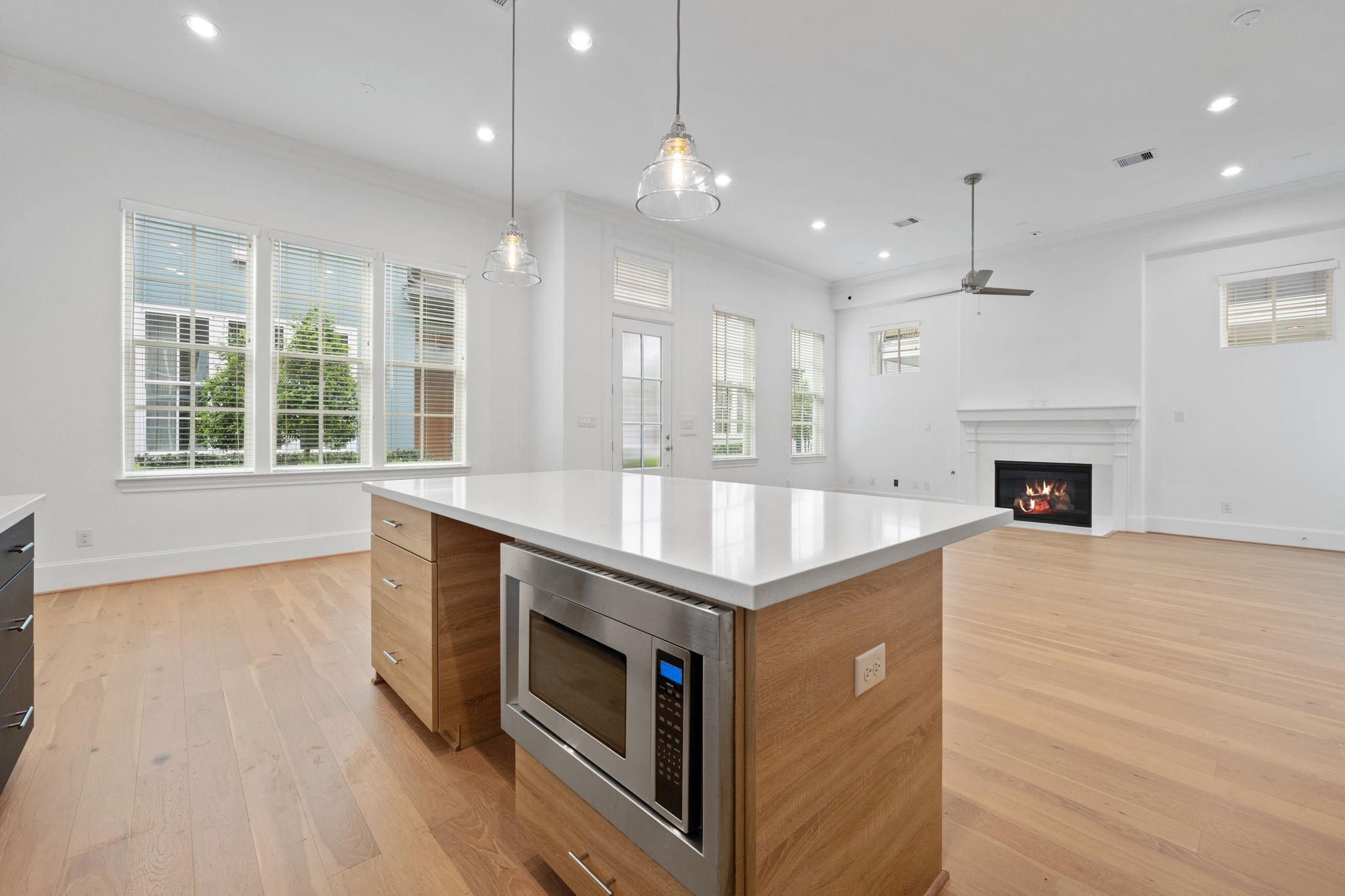 614 Delmar Street Houston, TX 77023 - Photo 14 of 36 a kitchen with kitchen island a stove a sink and wooden floor